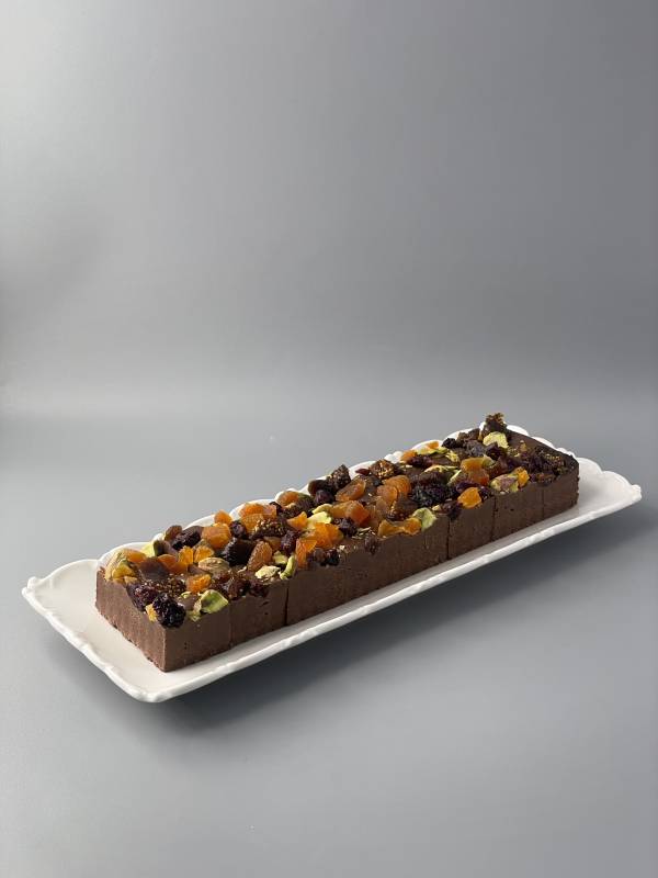 Homemade artisan cocoa fudge with mixed dried fruits and pistachios